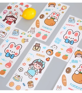 Macro detail of cute Japanese cartoon rabbit stickers with lemon and strawberry motifs