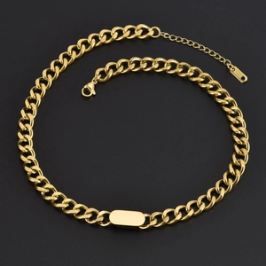 Golden stainless steel Cuban chain necklace with rectangular pendant on black background