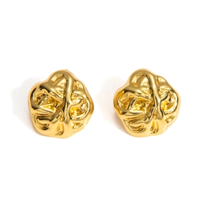 Macro shot of gold-plated stainless steel earrings with abstract crumpled texture
