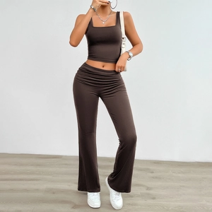 Deep brown two-piece knit set featuring a sleeveless square neck crop top and flared pants