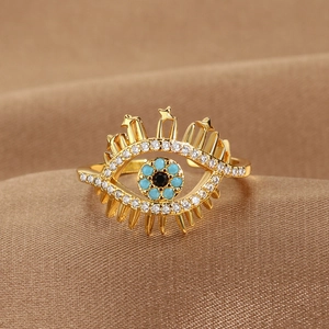 Anello regolabile Evil Eye dorato con pietre blu e zirconi bianchi su seta marrone