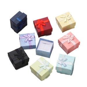 Colorful square paper jewelry boxes with ribbon bows and sponge pads for rings and earrings