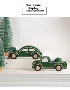 Close-up of wooden dark green Christmas car ornaments with gold glitter and faux snow
