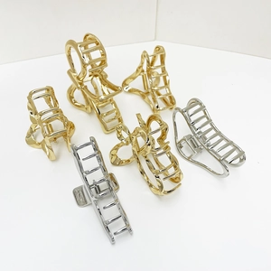 Set of 6 minimalist gold and silver alloy hair claw clips in various geometric hollow designs