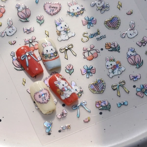 Cartoon rabbit nail stickers with 3D bows and heart patterns on manicured nails