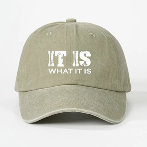 Olive green washed cotton baseball cap featuring vintage IT IS WHAT IT IS printed slogan