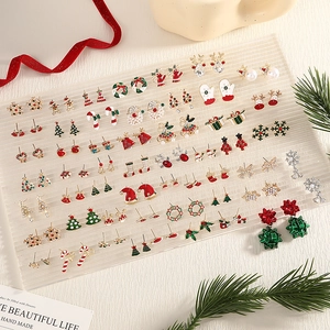 Festive Christmas earring set featuring reindeer, snowmen, and glittery trees