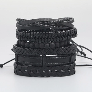 Set of six vintage black braided leather bracelets with various bead and weave textures