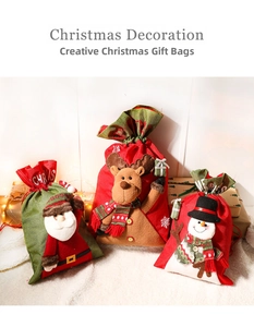 Detailed view of Christmas drawstring gift bags with 3D Santa, reindeer, and snowman dolls