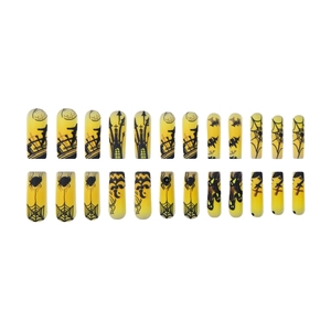 Halloween press-on nails with yellow base, pumpkin, spider web, and castle designs