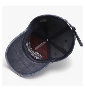 Detail view of 100% cotton washed baseball cap with adjustable metal buckle strap