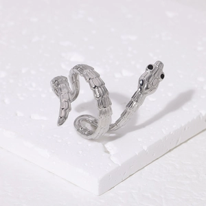 Macro shot of silver snake ring featuring detailed scales and 18K gold-plated stainless steel