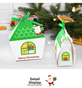 Detail of Christmas house-shaped gift box with festive Santa Claus print and green ribbon
