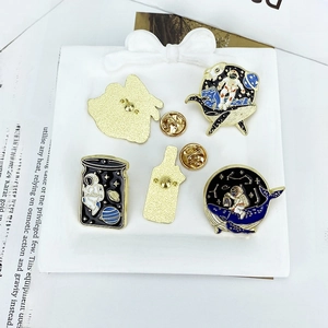 Cartoon astronaut and whale enamel pins set in zinc alloy with gold finish