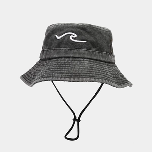 Detail view of washed dark charcoal bucket hat with white wave embroidery and windproof cord