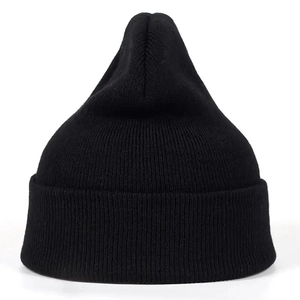 Close-up of black ribbed knit beanie showing high-elasticity fabric and cuff detail