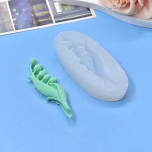 Lily of the valley flower silicone mold for DIY crafts on a blue background