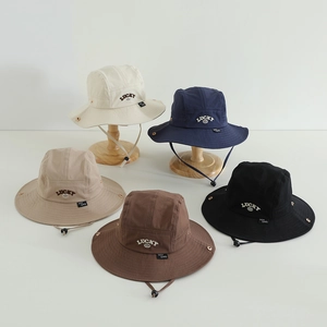 Kids outdoor sun protection bucket hats in various earth tones with adjustable chin strap