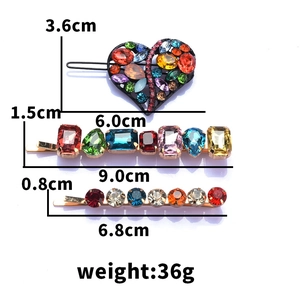 Detailed view of colorful gemstone hair clips set with size measurements and weights