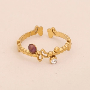 Detailed view of a gold butterfly ring with purple amethyst stone and crystal accent