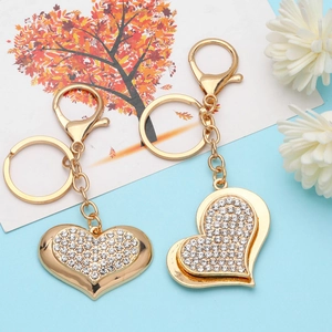 Golden heart-shaped keychain with sparkling rhinestones and lobster clasp for handbags
