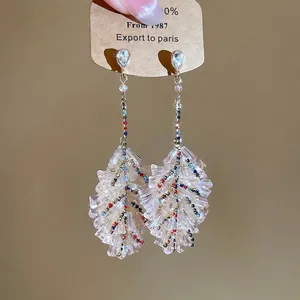 Bohemian crystal leaf drop earrings with colorful rhinestones in a gold setting