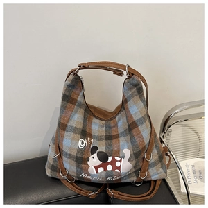 Detail of vintage plaid tote bag with cute puppy pattern and blue brown checkered fabric