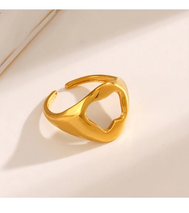 Detail of minimalist gold open ring with irregular geometric hollow design and polished finish