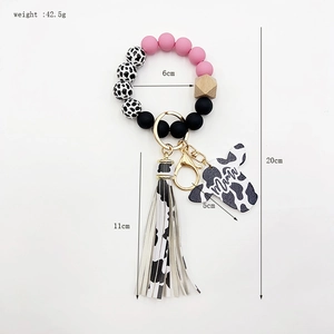 Cow print beaded wristlet keychain with pink silicone beads, tassel and Mama heart charm