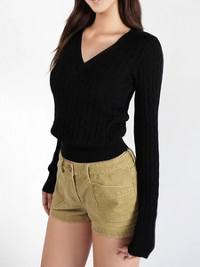 Slim fit black cable knit V-neck sweater paired with casual khaki corduroy shorts
