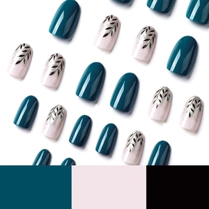 Press-on nails featuring dark green and pink colors with black leaf patterns and foil