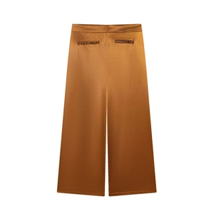 High-waisted wide-leg satin trousers in bronze silk finish with a minimalist silhouette