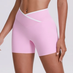 Detail of pink crossover high waist yoga shorts with white contrast binding trim