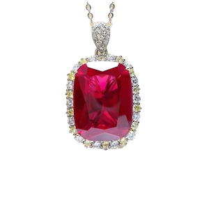Macro detail of luxury pigeon blood red ruby pendant with rectangle cut and pave diamonds