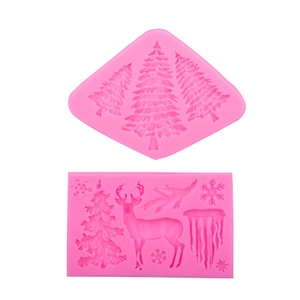 Pink silicone fondant molds featuring Christmas tree, elk, and snowflake patterns