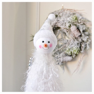 Detail of plush white snowman figurine with silver snowflake hat and soft textured fur