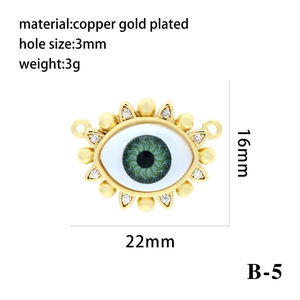 Macro view of 18k gold plated copper evil eye pendant with enamel and zircon details