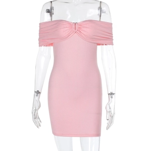 Close-up of pink off-shoulder mini dress with shimmering sequins and rhinestones