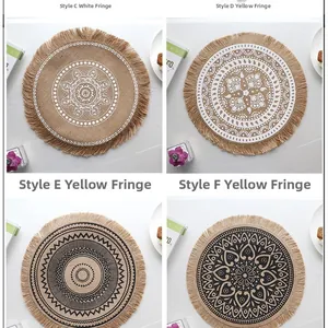Detail of four handmade jute placemats with fringe tassels and mandala patterns