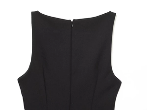 Close-up detail of the black sleeveless top featuring back invisible zipper and smooth fabric