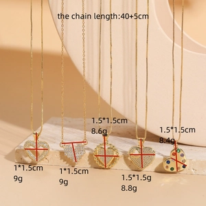 Elegant gold-plated stainless steel heart pendant necklace with zircon stones on stone base