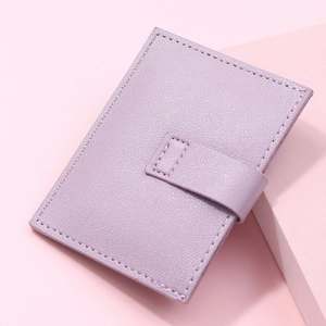 Detailed macro view of light purple lychee pattern leather card holder with buckle