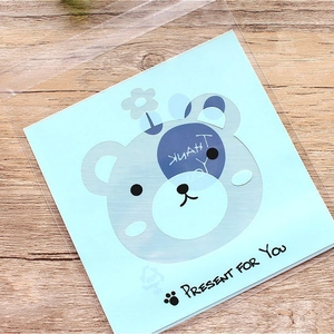 Translucent self-adhesive cookie bag with cute blue cartoon bear card for gift packaging