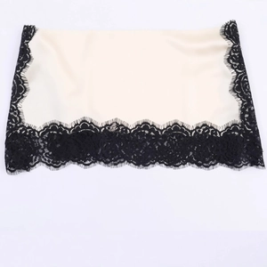 Elegant beige satin top with black lace trim edges and delicate hollowed-out lace texture