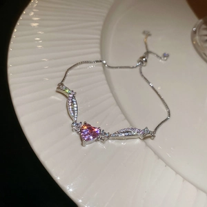 Detail of adjustable heart bracelet with purple zircon and micro-pave crystals