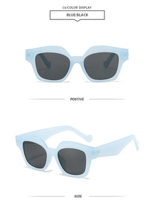 Detail view of blue translucent square sunglasses with gray lenses and matte frame finish