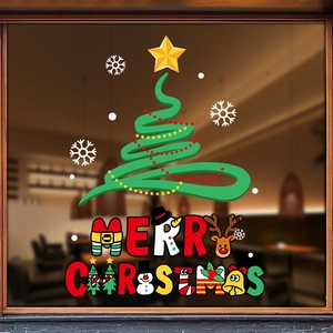 Christmas window stickers with reindeer and bell designs on a cafe glass display