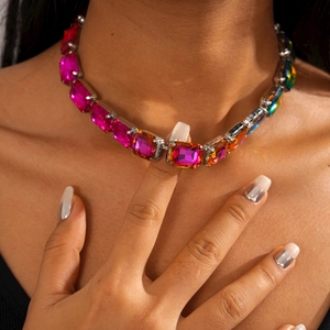 Close-up of sparkling pink crystal geometric choker necklace worn by a fashion model