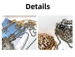 Close-up of heart-shaped hollow metal bag charms in gold and silver with bead chains