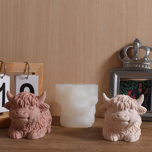 Detailed silicone mold showing textured highland cow sculptures and demolding results